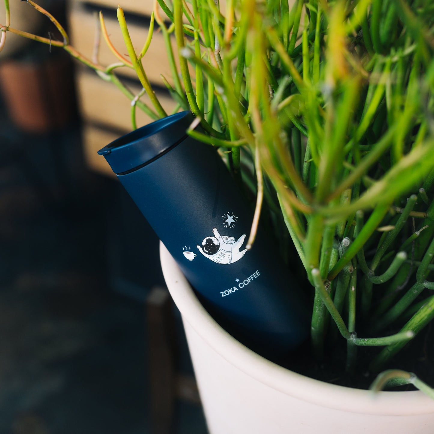 16 oz Miir Tidal Blue flip lid travel mug with astronaut design.