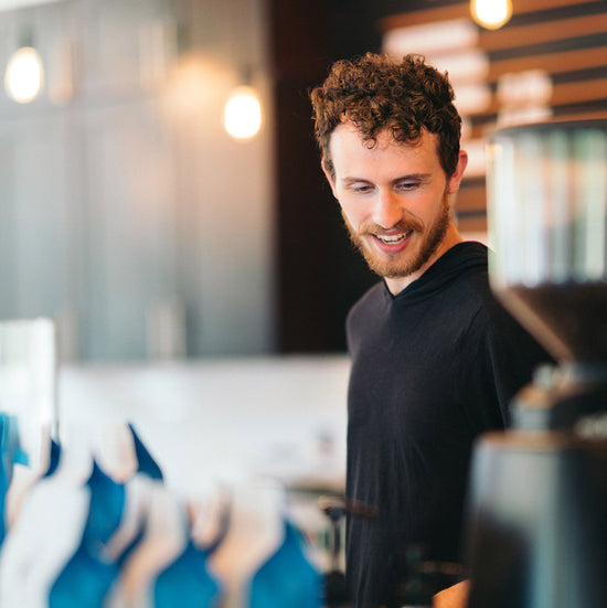 University Zoka employee making coffee