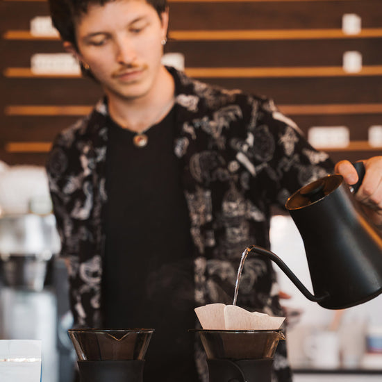 Greenlake Zoka employee making coffee