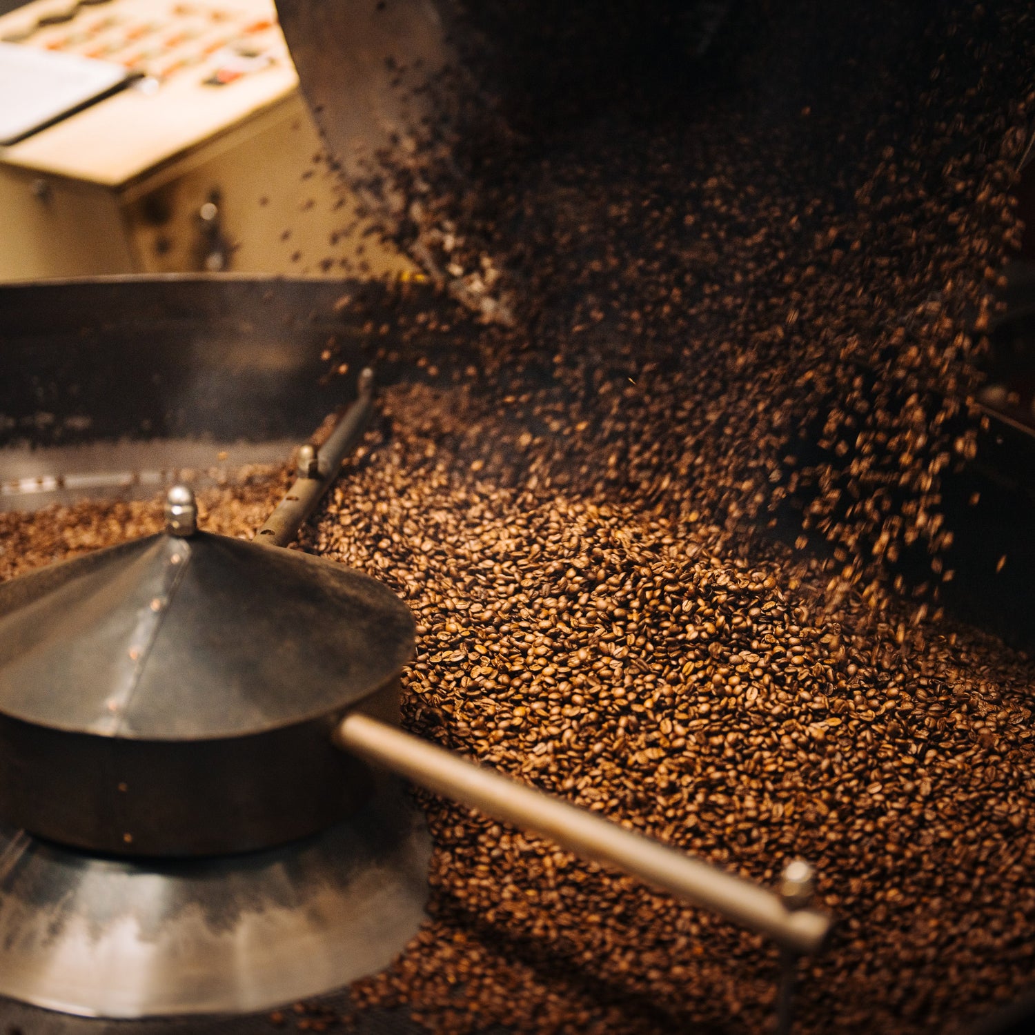 Coffee being released from Roaster at our Bellingham roasting facility 