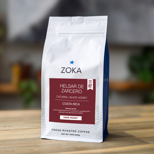 Zoka coffee bag on a wooden surface with a blurred background